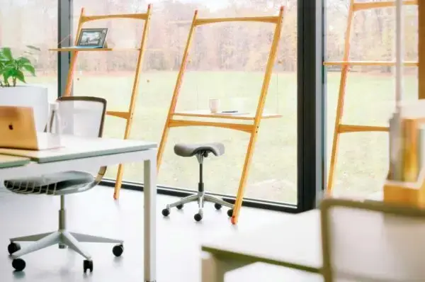 Work desk against a window - one of our five workspace wellness tips