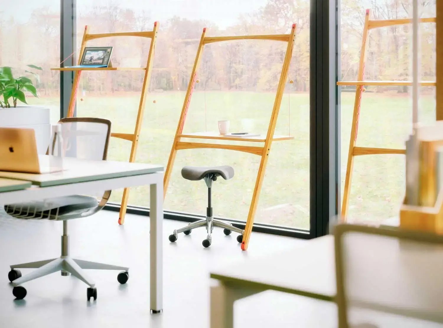 Work desk against a window - one of our five workspace wellness tips