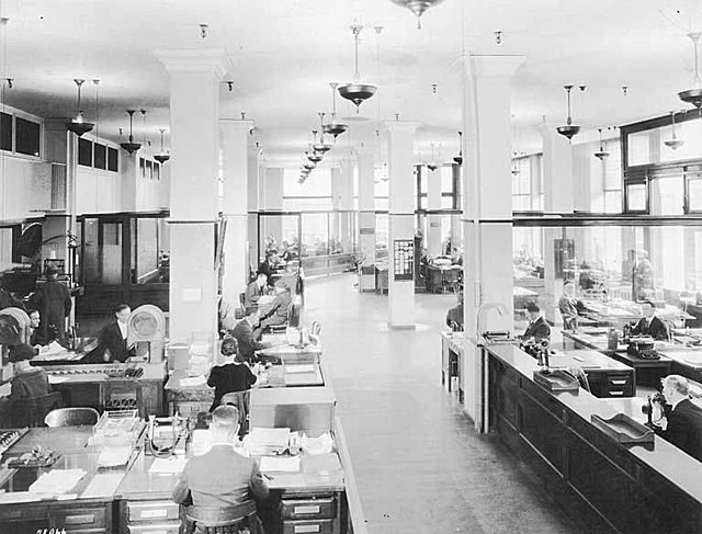 A rather inflexible workspace, showing Seattle Hardware Company employees working at desks, Seattle, ca 1923