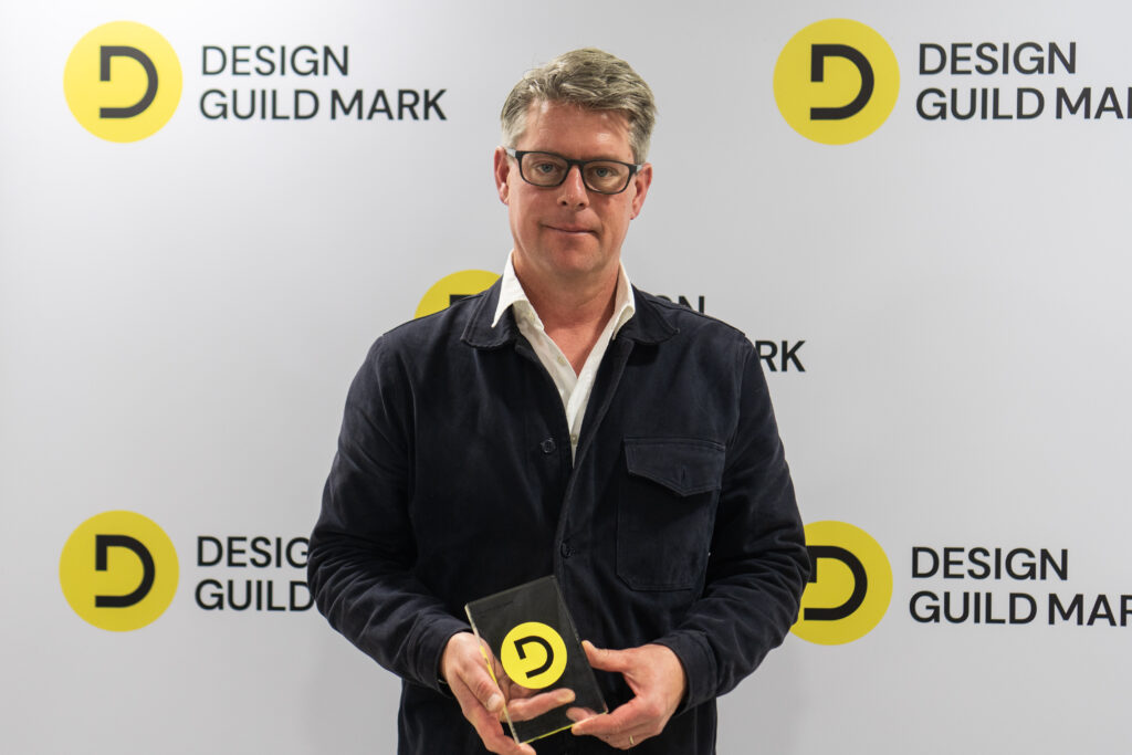 Henry Swanzy, designer of Leandesk presented with a Design Guild Mark award at Clerkenwell Design Week 2026